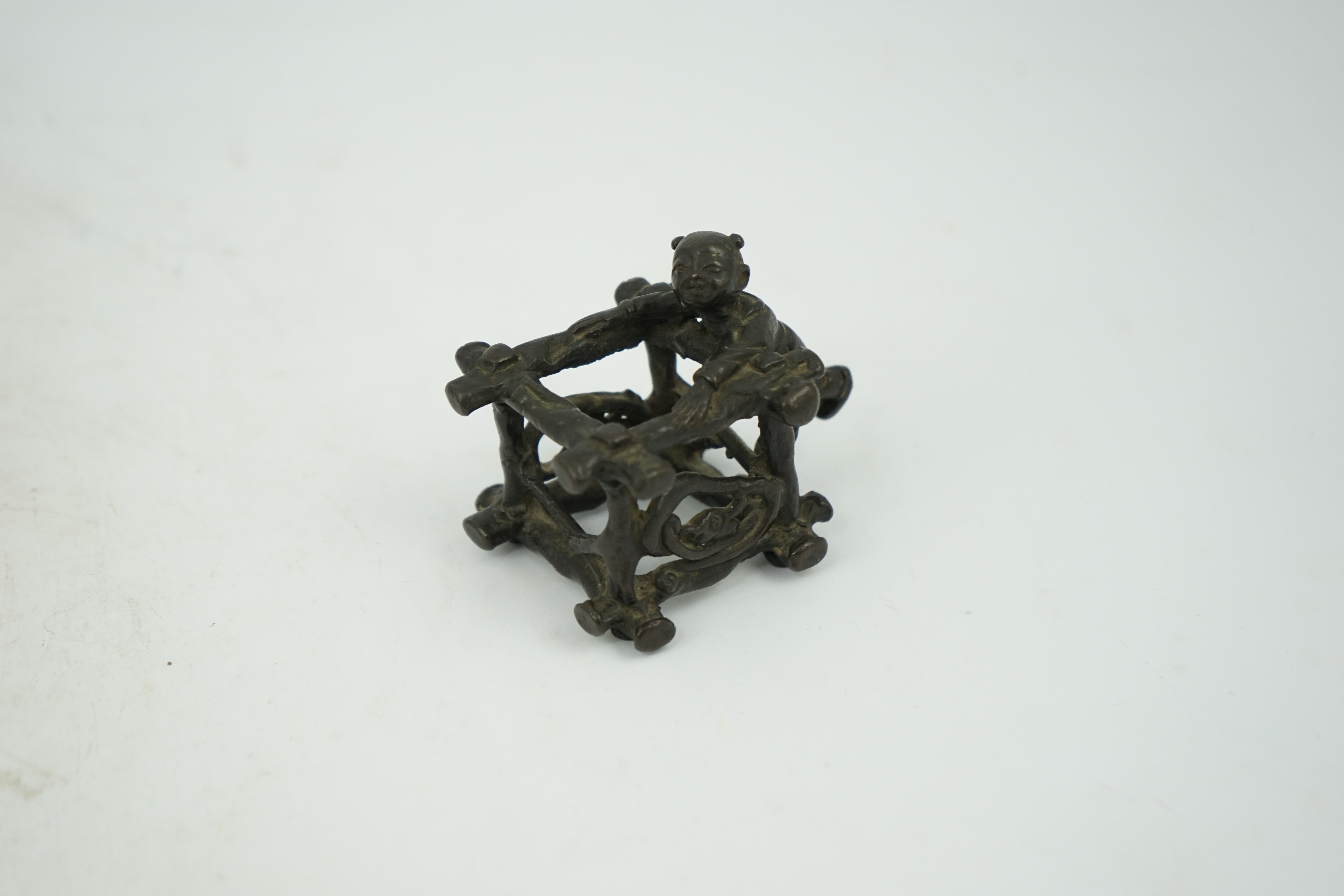 A Chinese bronze figural scroll weight, late Ming